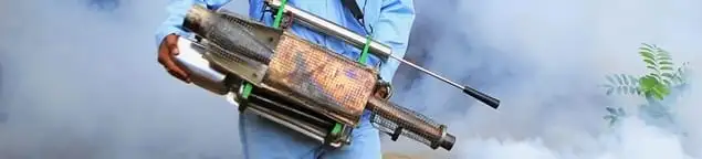 Fumigation technician using a fogger for deep pest treatment in Gilbert, AZ